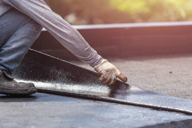 Professional Basement Waterproofing technician working in Oxford, KS